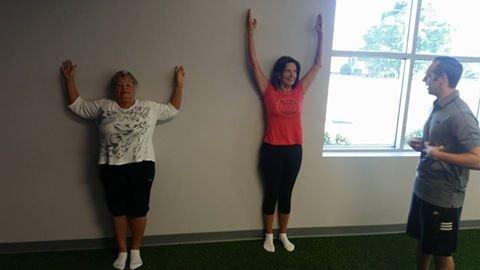 Wall slides for shoulder and scapula mobility.