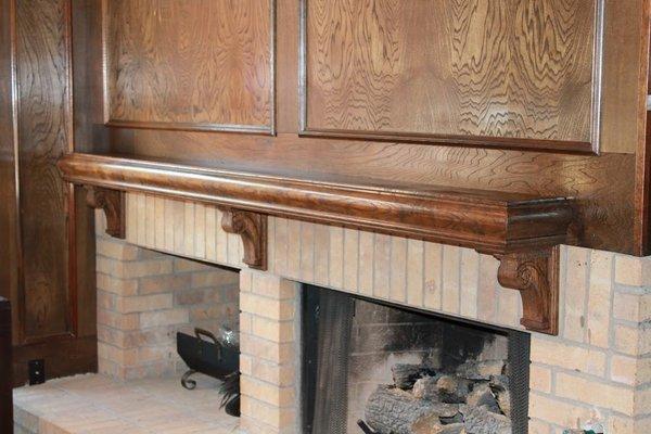 Custom modification of mantle utilizing existing, vintage trim and mantle and incorporating new custom corbels for a fresh look