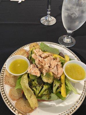 Salmon Salad on fresh organic greens and vegetables. Lemon vinaigrette dressing.