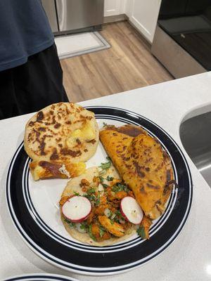 Cheese pupusa, chicken taco, birria taco