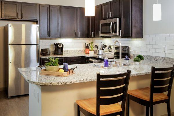 Kitchen area inside a loft at Mercer Landing. All appliances are included!