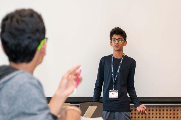 Two students in a classroom debate