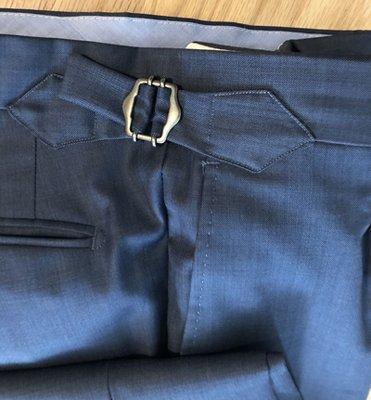 Mr Nam was able to transform my pants by adding stylish side adjusters and removing all the belt loops !