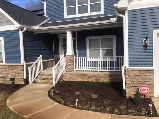 Curb appeal landscaping solving drainage issue from downspout in Statesville, NC