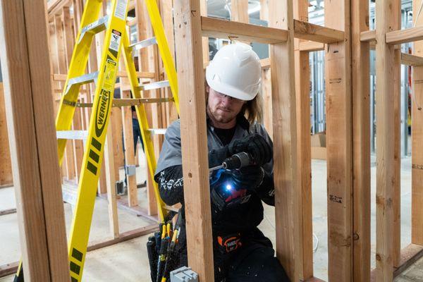 Electrical Technician student working in lab.