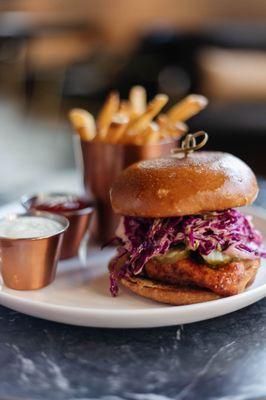 Fried Chicken Sandwich with Hot Chili Honey, Slaw, Pickles, and Homemade Fry Sauce, served with your choice of Fries or Salad.