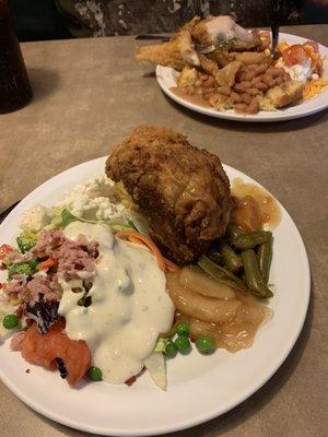 Salad, fried chicken, green beans, yams, apples