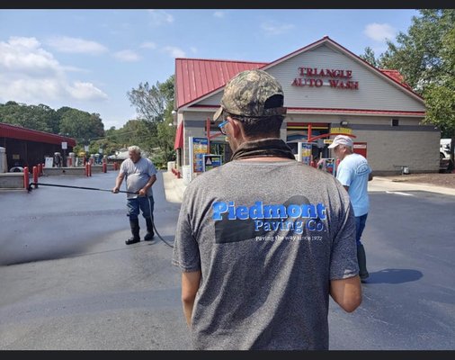 Car wash parking lot being resurfaced