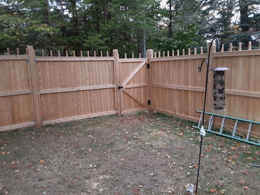 Stockade fence with side gate