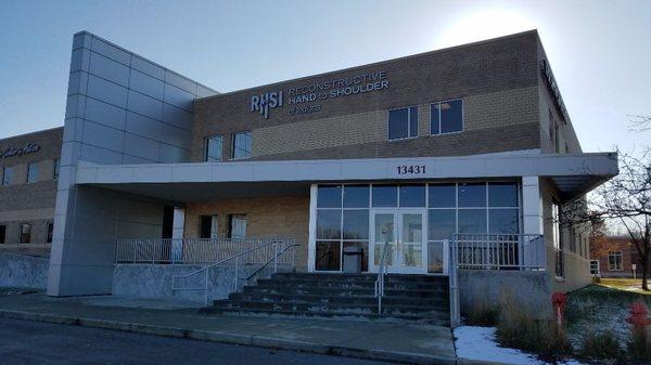 North entrance to RHSI, wheelchair accessible ramp west of this door near handicapped parking.