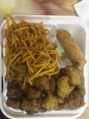 Orange chicken, lo mein and an egg roll