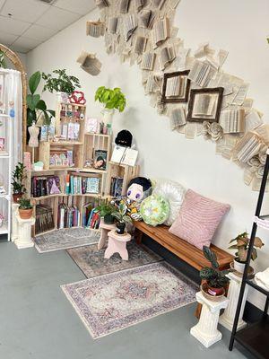 Book wall, books, used books, stickers, plants