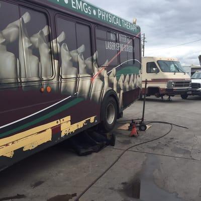 This is a photo of our two mechanics replacing air line fittings on an Optima bus that the customer converted into his home.