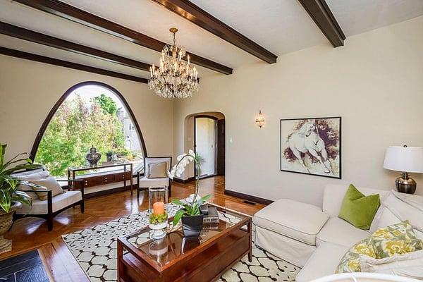 Spanish architecture with tile roof, arched front window. Updated eat-in kitchen w/stainless steel appliances, wood beamed ce...