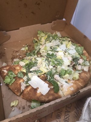 Thin crust 12" Thin Crust Chicken Caesar Pizza -- literally just Caesar salad thrown onto a bare (not so thin) pizza crust ‍