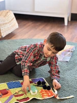 Playing with a sensory toy.