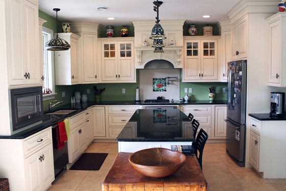 Elegant, white painted kitchen with inset style cabinetry.