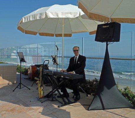 Pianist Kevin Fox getting ready to play for a corporate event at the Coral Casino Beach & Cabana Club in Santa Barbara, California.