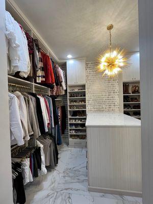 Light and bright but not white.  We really took this gorgeous closet in Edmond up a notch by adding a beautiful light fixture and wallpaper.