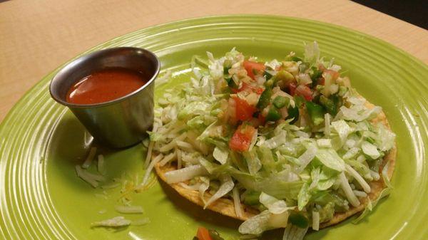 Avacado Tostada served with homemade peanut habanero sauce