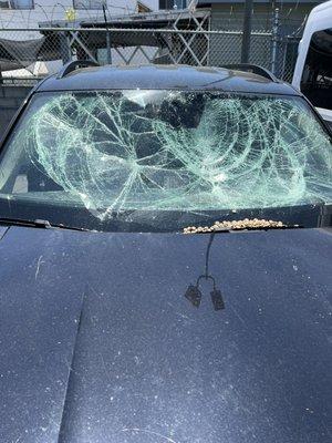 The windshield was completely damaged and caving in.