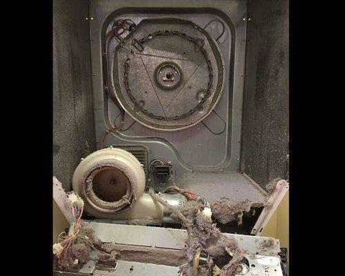 What a dryer looks like inside if not cleaned in 10 years. That lint is a FIRE HAZARD! Hire a pro to disassemble & clean it every 2 years