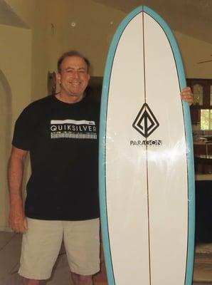 Bill Schieber with first Paragon surfboard opened.