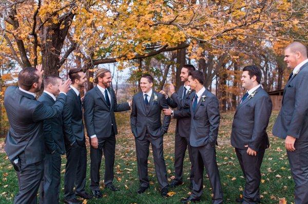 My groom and his groomsmen taking pictures out on the lawn. Photo by Katie Webb.