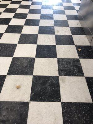 Pizza rolls on the floor.