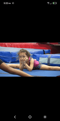 My daughter I galactic gymnastics 5 years old.... As you can see the girl in front of her couldn't even do her split.