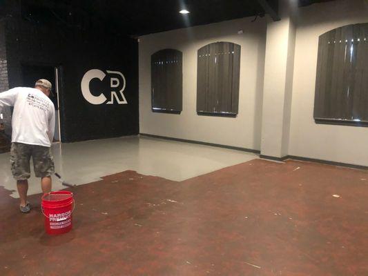 Applying a durable floor coating in a local church.