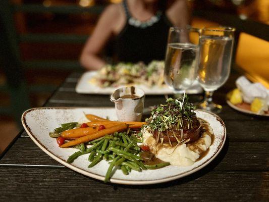 Meatloaf with mashed potatoes, green beans, and carrots.