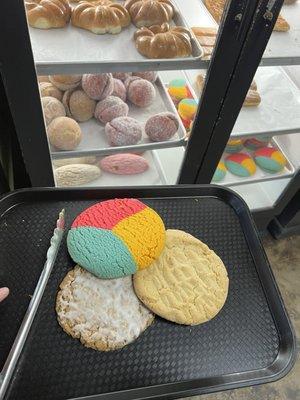 Oatmeal cookie, peanut butter cookie and multi colored cookie.