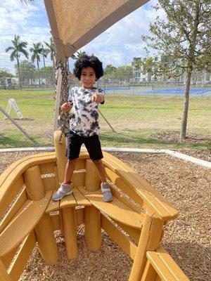 My grandson playing pirate on the boat