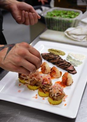 Chef Tim plating up a tasting for a bride and groom!