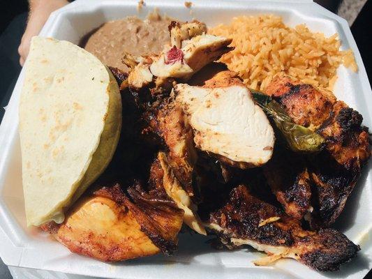 Half chicken comes piping hot with rice beans & tortillas. Ask for the HOT sauce on the side OMG! Bueno Bueno! Get it! :)..