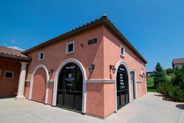 Image of Rejuvenate MedSpa Colorado Springs' front door, as viewed from the plaza parking lot