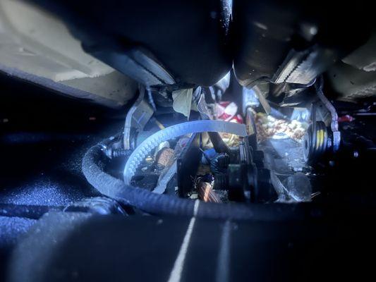 Left over food under seat of third row after inside car detail