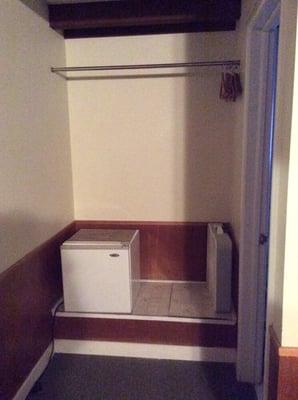 Fridge, fan and clothes hanger.