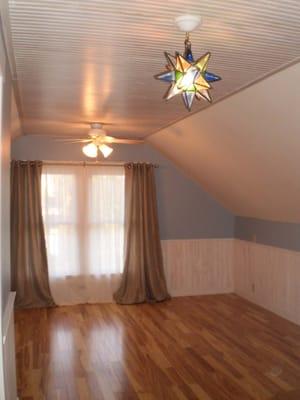 Bedroom renovation. Installed flooring, hung sheetrock, installed wainscoting, trim, painted