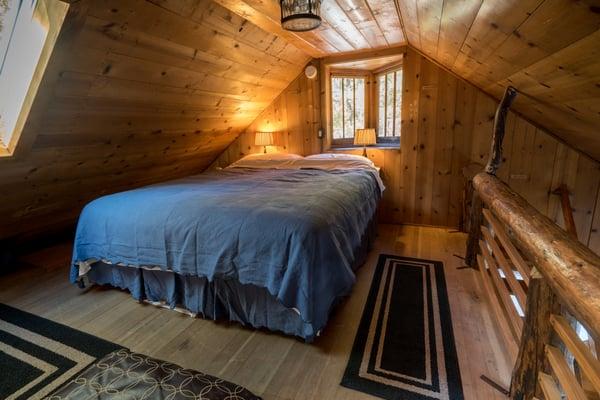 Kind bed in the upstairs loft, cozy accommodations for you and yours.