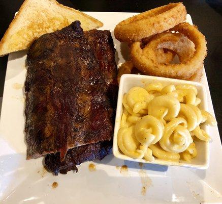 Half rack of ribs with Mac n cheese and onion rings