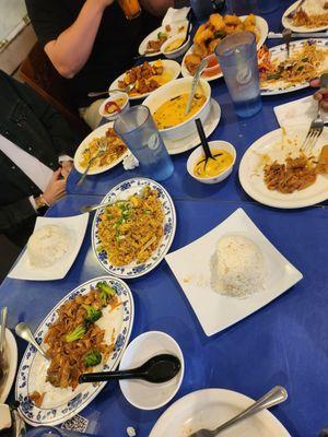 Pineapple fried rice, pad thai, orange chicken, steamed rice, fried appetizer.