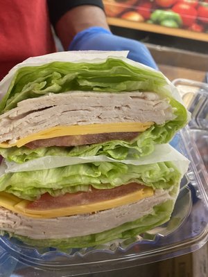 Turkey and American cheese, tomato, in a romaine lettuce wrap.