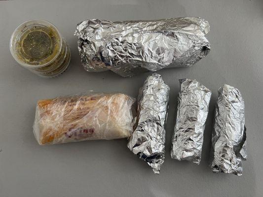 carne asada burrito, tamale and 3 tacos with green sauce