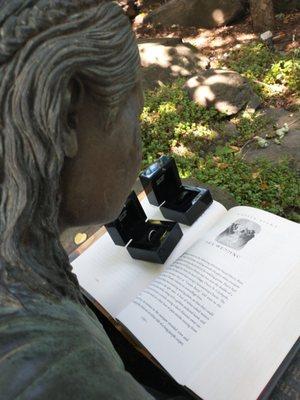 Our photographer put the Unbreakable Vow chapter of HP #6 in the statues arms for a cute ring picture.