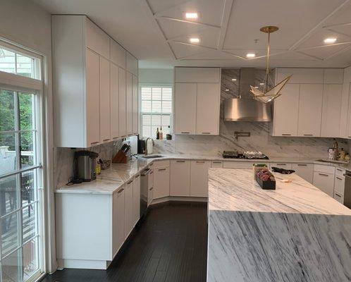 White St. Martin cabinetry with quartz waterfall island, Baltimore, MD