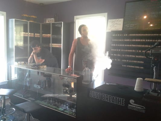 Casey helping a customer, Alex showing me his 4nine Mech Mod.