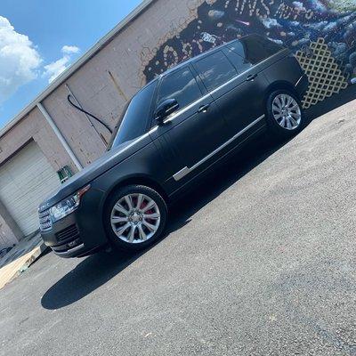 Jet black wrap with red calipers.