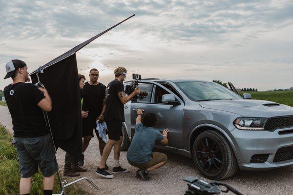 Production crew prepping the car for the next shot.